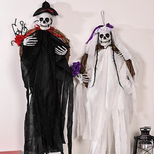 Halloween wreath set with skeleton bride and groom hanging on white wall for party decor
