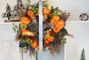 Autumn wreath detail showing 45cm diameter with orange peonies and pumpkins