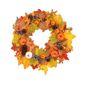 Autumn wreath with maple leaves, pumpkins, and pine cones for Thanksgiving and Halloween decor
