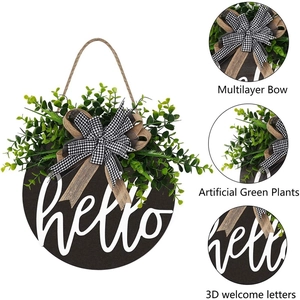 Round wooden door sign with 3D hello text, eucalyptus leaves, and buffalo plaid bow