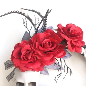 Gothic Halloween wreath with deep red faux roses, skull accent, and black dry branches