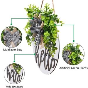 Wooden hello door wreath with faux eucalyptus leaves and black white checkered bow decoration