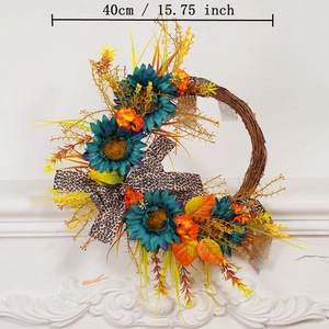 40cm autumn wreath with teal sunflowers, leopard bow, and maple leaves on a white fireplace