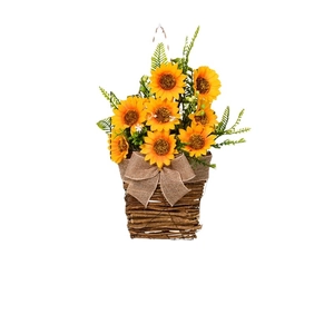 Artificial sunflower hanging basket decor with yellow flowers and a burlap bow on white background
