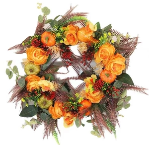 Autumn pumpkin wreath with orange roses, berries and fern leaves for farmhouse door decor