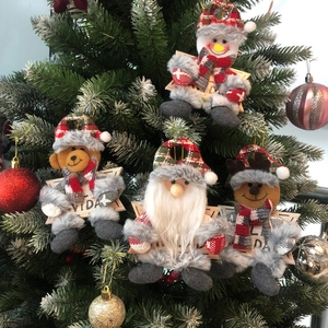 Christmas tree ornaments set featuring snowman, bear, Santa and reindeer hanging on tree
