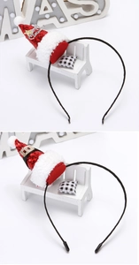 Detail of red sequined Christmas hat headbands with Merry Christmas lettering and white fur trim