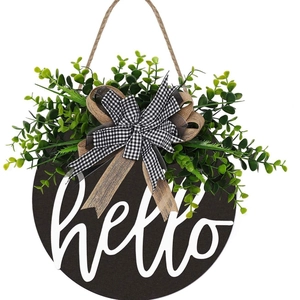 Black wooden hello welcome door wreath with artificial greenery and burlap bow decoration