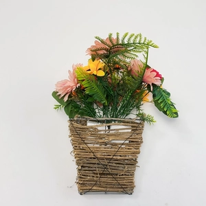 Close-up of artificial daisies in a woven wicker basket for wall decoration