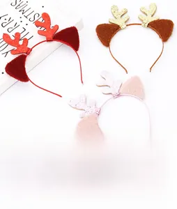 Detail shot of plush Christmas reindeer antler headbands with glitter and soft ears
