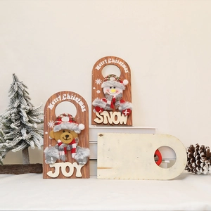 Christmas wooden door hangers featuring plush snowman and bear designs with festive messages