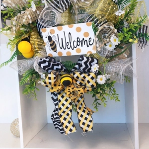 Bee festival welcome wreath with artificial flowers and ribbons for wall decor