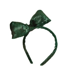 Sparkly green velvet headband with oversized bow for Christmas holiday hair styling