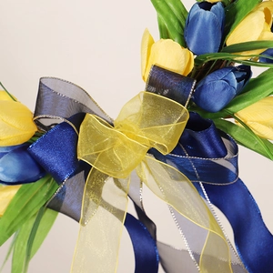 Artificial yellow and blue tulip wreath with elegant layered ribbon for home wall decor