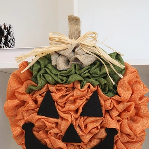 Halloween fabric pumpkin hanging decor with burlap texture and jack-o-lantern face