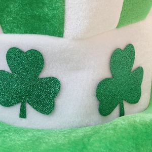 Green and white striped St. Patrick's Day hat with glitter shamrocks in velvet texture