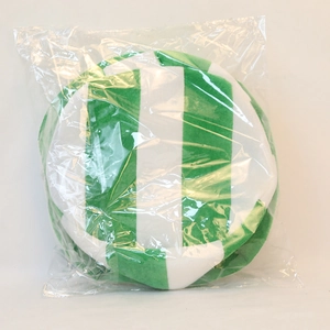 Detail of green and white striped plush Irish festival hat in protective clear packaging