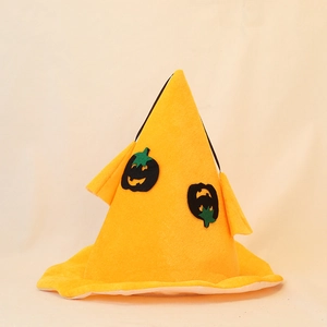 Close-up of yellow pointed Halloween wizard hat with black pumpkin and green leaf details