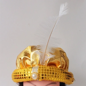 Detail of Aladdin turban hat with gold sequins, faux pearl, and white feather plume