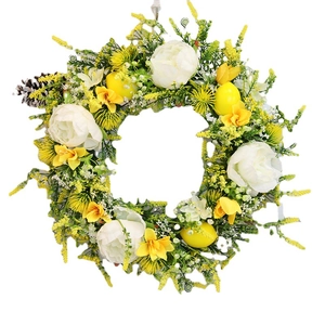 Artificial flower wreath with yellow lemons, white peonies, and pine cones for front door decor