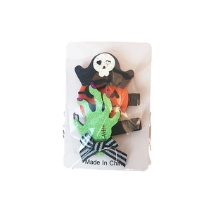 Halloween hair clips set with pumpkin, ghost hand and skull on display card packaging