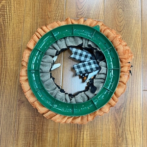 Back view of Halloween ghost wreath with orange burlap fabric and plastic ring base