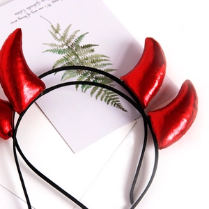 Sparkly red devil horn headband for Halloween costumes on a minimalist lifestyle background