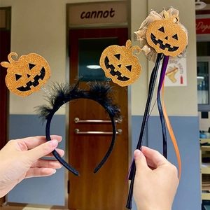 Halloween set featuring orange glitter pumpkin headband and magic wand with ribbons