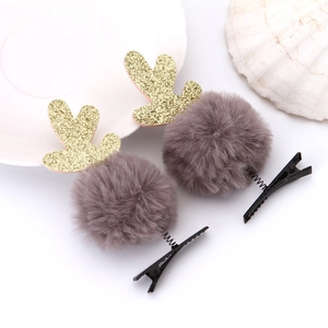 Fermagli natalizi con pompon grigi e corna di renna dorate con glitter scintillanti