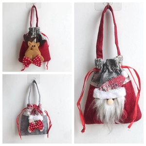 Detail of Christmas candy bags featuring reindeer, snowman and Santa Claus felt 3D appliques