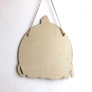 Back view of natural wooden pumpkin hanging ornament with jute rope for Halloween decor