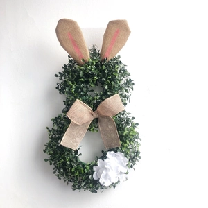 Easter rabbit shaped wreath with artificial green leaves and burlap ears for wall decor