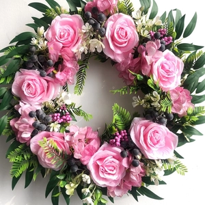 Close-up of artificial 45cm wreath with pink roses, hydrangea petals, and dark berries
