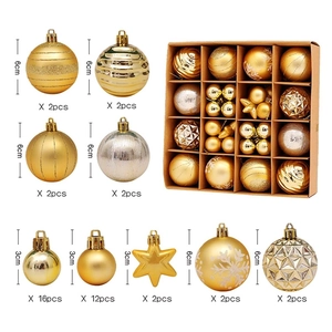 Detailed view of assorted gold Christmas ball ornaments with 6cm and 3cm sizes