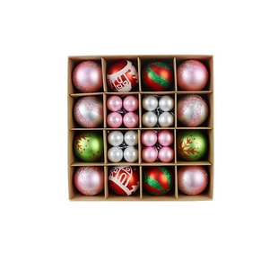 Detailed set of varied Christmas tree ornaments in red, pink and green divided storage