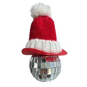 Christmas disco ball ornament with red knit Santa hat for creative holiday party decor