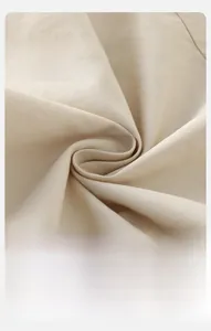 Detailed macro view of soft breathable cream textile fabric for baby jackets