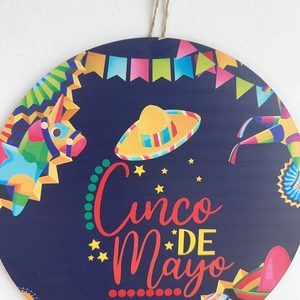 Cinco de Mayo round wooden welcome sign with Mexican hat and pinata party decorations