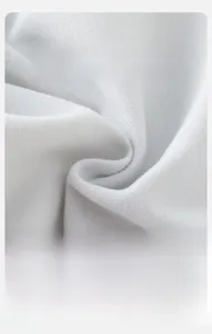 Close-up of soft breathable white knitted cotton fabric for baby girls sports set
