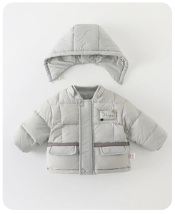Detail view of winter puffer jacket featuring a detachable hood and snap buttons