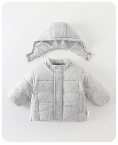 Close-up of baby winter coat with Ubenta embroidery and metallic snap buttons detail