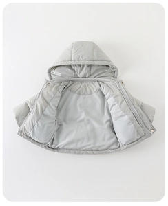 Detailed macro view of gray infant down jacket showing zipper and waterproof fabric