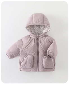 Detailed view of baby winter coat with floral hood lining and soft purple quilted fabric