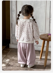 Detail of baby girl floral sweatshirt with lace collar and purple lantern pants back view