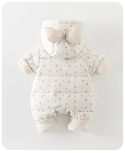 Detail of floral infant snowsuit showing quilted fabric and a cute bow on the hood