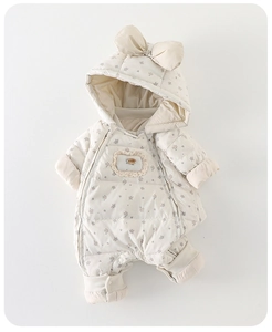 Detail of baby winter floral padded romper with quilted fabric and lace decoration
