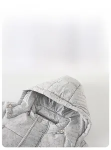 Detail view of the gray hooded baby jacket with windproof zipper and metal snap buttons
