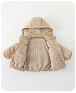 Detailed interior of a beige hooded down jacket for infants with ribbed cuffs