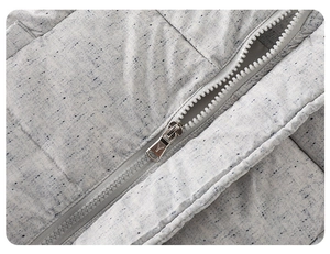 Close-up of light grey speckled fabric texture and high-quality resin zipper detail