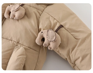 Detailed view of baby quilted winter jacket with cute 3D plush elephant decoration